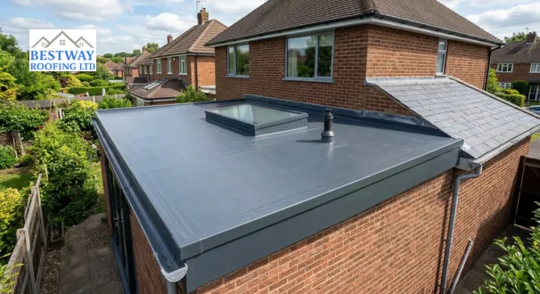 Completed dark grey GRP fibreglass flat roof installation on a modern brick residential extension featuring a central roof lantern skylight.