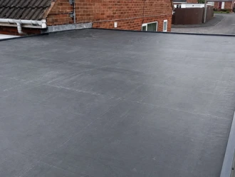 Seamless flat roof installation using high-quality weatherproof materials by expert Chelmsford roofers.