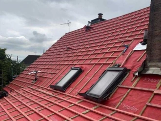 Mid-progress roof repair in Chelmsford showing red Marley breathable underlay membrane and new timber battening.