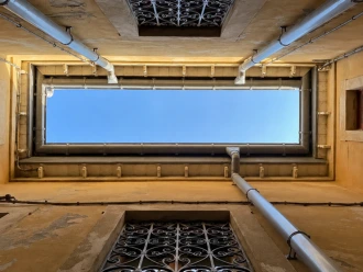 Professional installation of premium UPVC gutters to protect property walls from rainwater damage.
